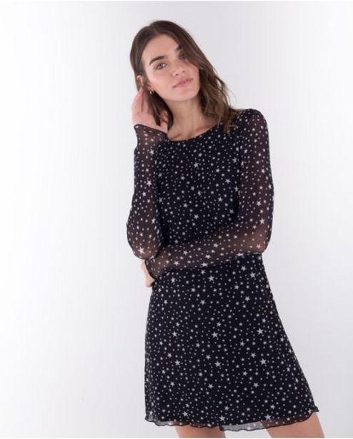Oferta de Vestido corto para mujer negro manga larga con estrellas estampadas y mangas en mesh por $118930